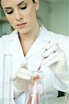 Young woman working in scientific laboratory