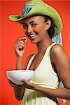 Woman Eating Bowl of Cereal
