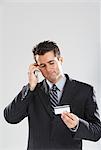 Man with Cellular Phone and Credit Card