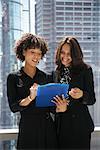 Businesswomen Looking at Document