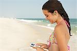 Girl on Beach With Mp3 Player