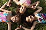 Portrait of Children Laying on Grass