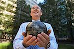 Businessman Holding Globe