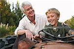 Grandfather and Grandson on Tractor