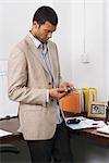 Businessman Checking Cell Phone