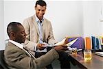 Businessmen at Desk