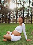 Pregnant Woman Sitting on Grass