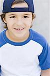 Portrait of Boy Wearing Baseball Cap Backwards - Stock Photo - Masterfile -  Rights-Managed, Artist: Dan Lim, Code: 700-00057787