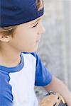 Portrait of Boy Wearing Baseball Cap Backwards - Stock Photo - Masterfile -  Rights-Managed, Artist: Dan Lim, Code: 700-00057787