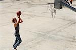 Teenager Playing Basketball