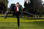 Businessman Playing Soccer