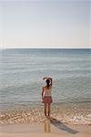 Woman Wading in Ocean, Sardinia, Italy