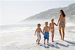 Mother and children on a beach