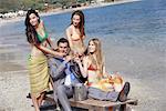 Businessman on beach with three women