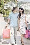 Couple walking with shopping bags