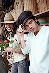 Couple posing with hats