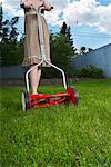 Woman Mowing the Lawn