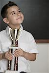 Boy holding a trophy