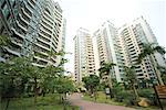 China, Guangdong Province, Guangzhou, park and high rise apartments