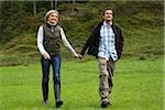 Couple Walking in Field