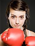 Closeup of teenage girl with boxing gloves