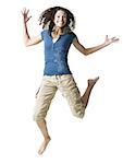 Teenage girl leaping and smiling