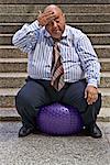 Businessman Using Exercise Ball