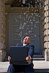 Businessman with Bubbles Coming out of Briefcase