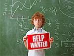 Boy Holding Help Wanted Sign