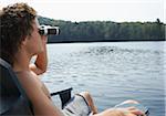 Man on Dock, Using Binoculars