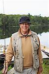 Man by Lake with Fishing Gear