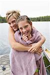 Mother Drying Son off on Dock