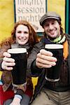 Couple with Beers on Bar Patio, Ireland