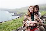 Couple Sitting on Stone Wall, Ireland