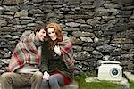 Couple Sitting by Stone Wall, Ireland