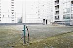 Empty Tennis Court on Urban Rooftop