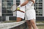 Tennis Players Embracing at Net