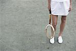 Vue sur les jambes du joueur de Tennis sur le Court de Tennis