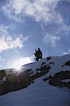 Snowboarder Standing on Mountain
