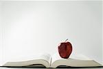 Apple on a book