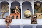 Low angle view of antique handicraft objects displayed in front of a house, Pushkar, Rajasthan, India