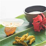 Close-up of spa treatment products on a banana leaf