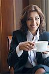 Close-up of a businesswoman holding a cup of tea