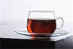 Close-up of a cup of herbal tea on a saucer