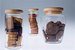 Close-up of three jars of various biscuits