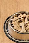 Close-up of dog biscuits in a dog bowl