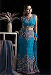 Mid adult woman standing in lehenga choli