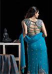 Rear view of a mid adult woman standing in lehenga choli