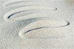 Squiggly pattern drawn in sand