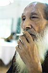 Elderly man smoking cigarette